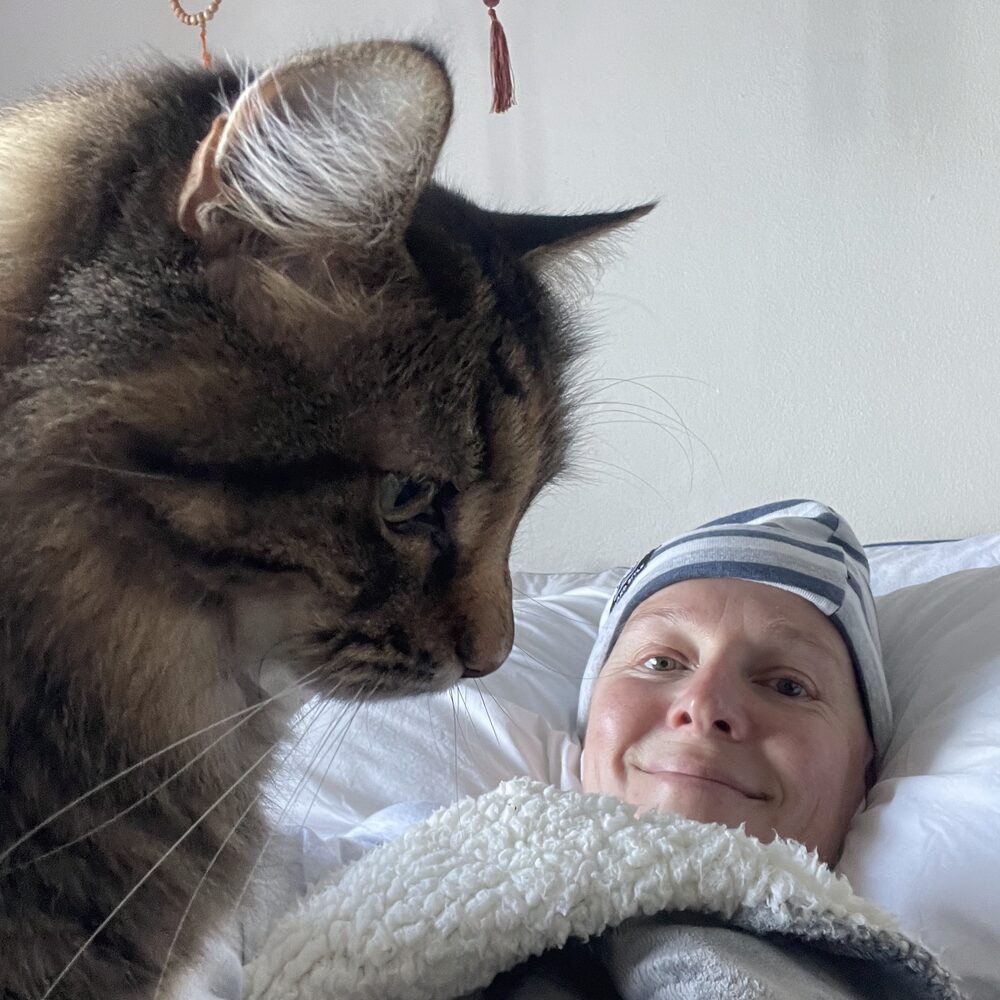 A tender moment at home with a cat